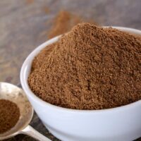Indian garam masala spice powder in a white bowl