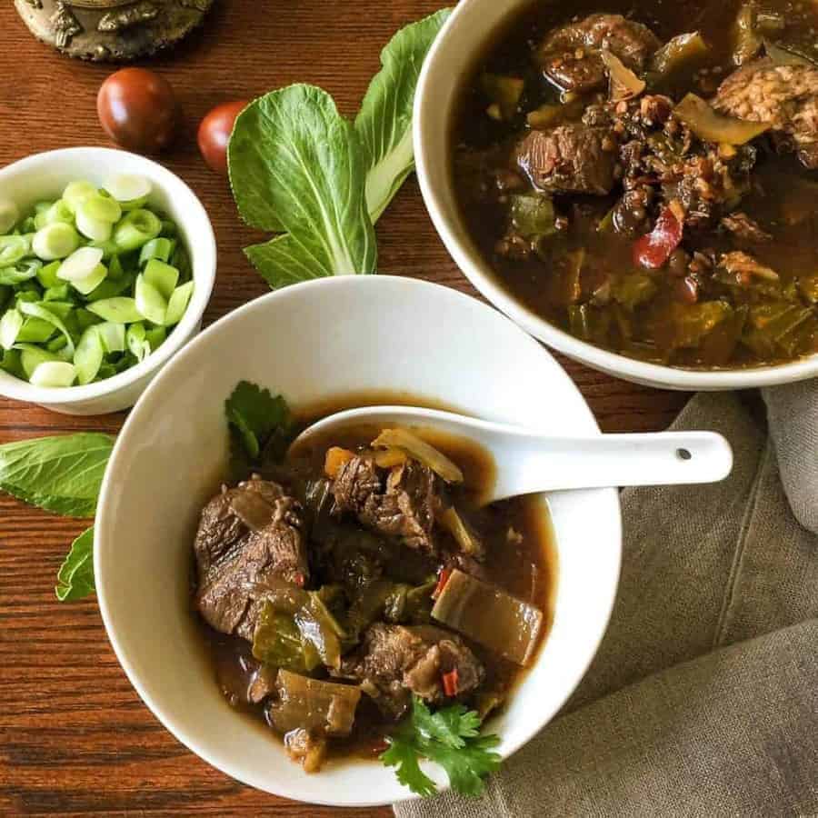 Flavorful, low carb version of Szechuan Pork Soup substitutes bok choy for the noodles, while keeping the traditional flavors of this soup. Pressure cooking makes the meat super tender. 