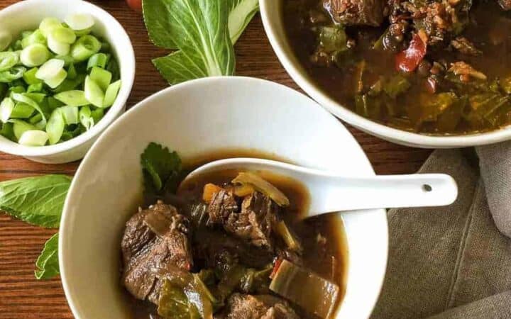 Flavorful, low carb version of Szechuan Pork Soup substitutes bok choy for the noodles, while keeping the traditional flavors of this soup. Pressure cooking makes the meat super tender.