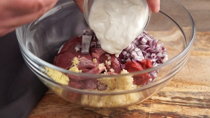 adding yogurt to ingredients for instant pot lamb rogan josh