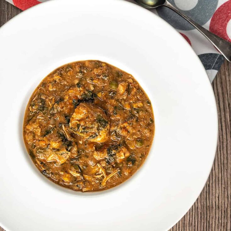 Overhead image of African Peanut Soup served in a white bowl