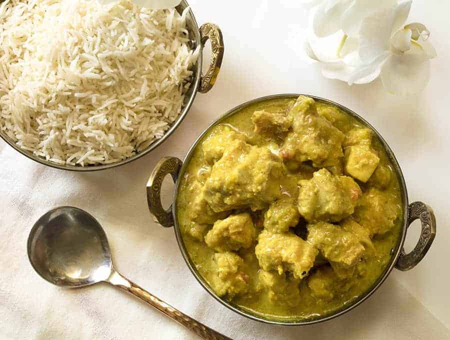 Instant pot chicken korma recipe overhead view with rice in the background