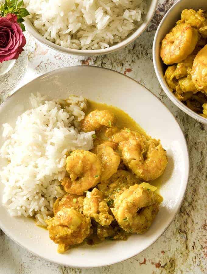 shrimp with coconut milk served in a white bowl