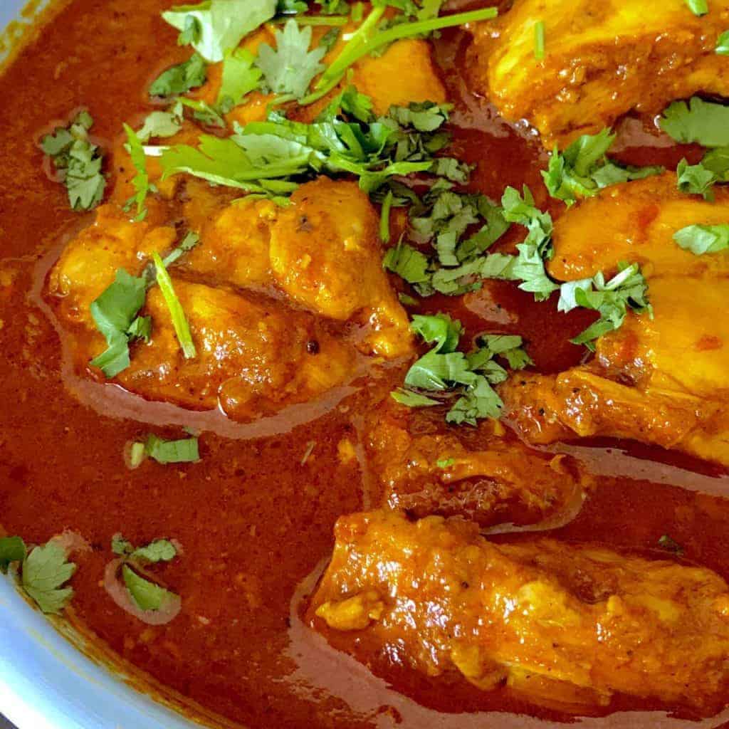 Make spicy, authentic Indian Chicken Vindaloo in your pressure cooker or Instant Pot, without dirtying every dish in your house. Makes a great weeknight supper.