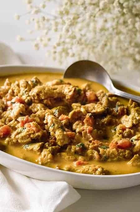 Vegetarian Butter Chicken in a white serving platter with a serving spoon