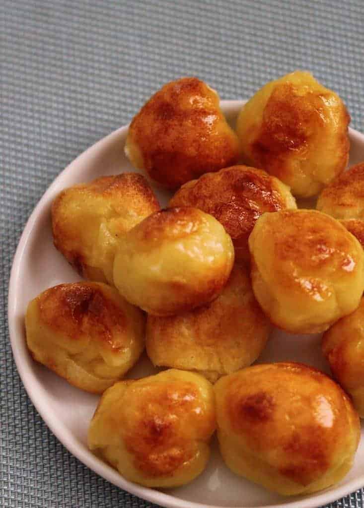 Instant Pot Pao de Quiejo to make the famous Brazilian cheese bread at home. This gluten-free delight is steamed and then broiled. Just tapioca flour, milk, oil, eggs, and cheese make up this delightful bread.