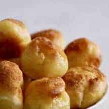 Instant Pot Pao de Quiejo to make the famous Brazilian cheese bread at home. This gluten-free delight is steamed and then broiled. Just tapioca flour, milk, oil, eggs, and cheese make up this delightful bread.