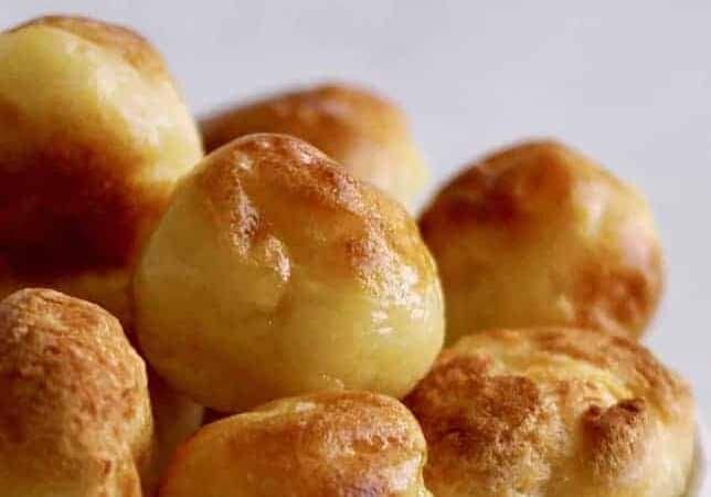 Instant Pot Pao de Quiejo to make the famous Brazilian cheese bread at home. This gluten-free delight is steamed and then broiled. Just tapioca flour, milk, oil, eggs, and cheese make up this delightful bread.