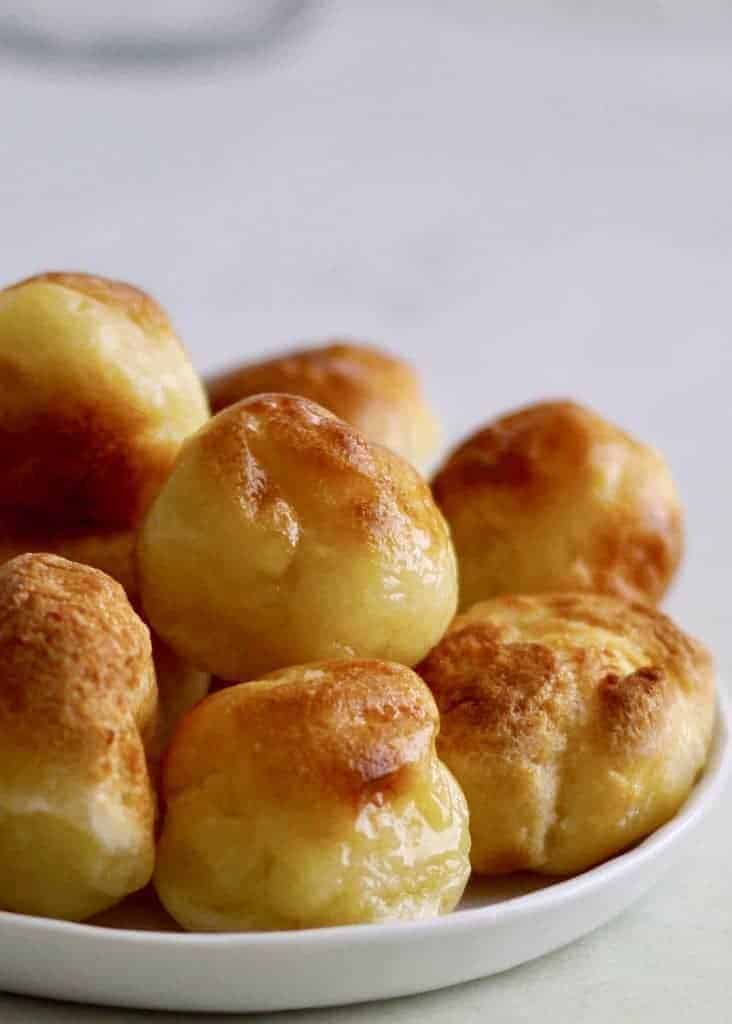 Instant Pot Pao de Quiejo to make the famous Brazilian cheese bread at home. This gluten-free delight is steamed and then broiled. Just tapioca flour, milk, oil, eggs, and cheese make up this delightful bread.