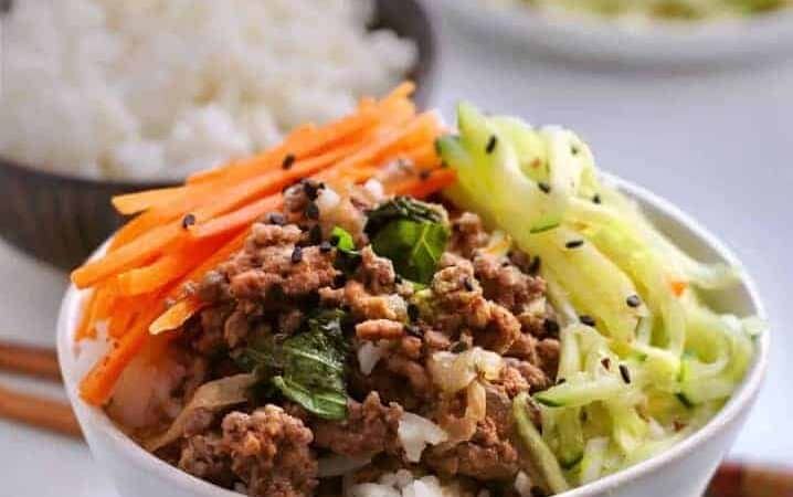 Cook a spicy basil beef along with a pot of rice at the same time in your pressure cooker. Make a quick-pickled salad while they cook, to serve a healthy, fast dinner.