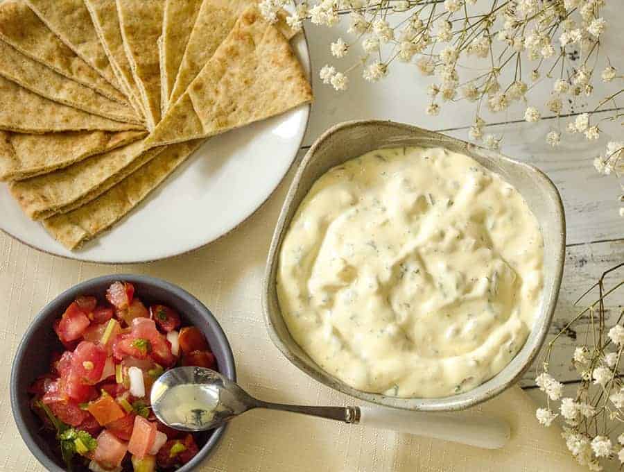 Plate of Bread with two bowls of ingredients.