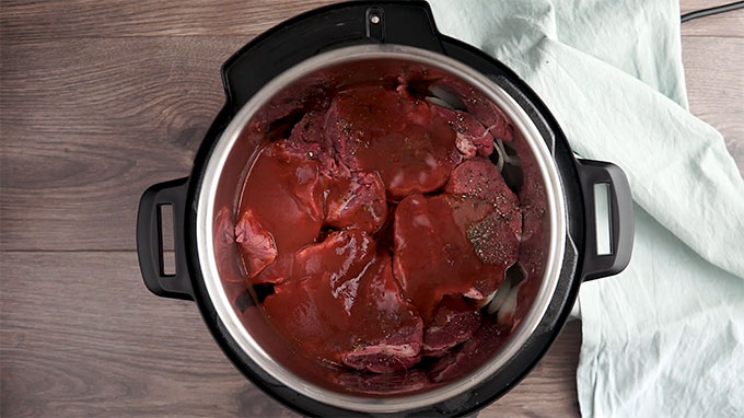 Overhead shot of the brisket added to the Instant Pot.