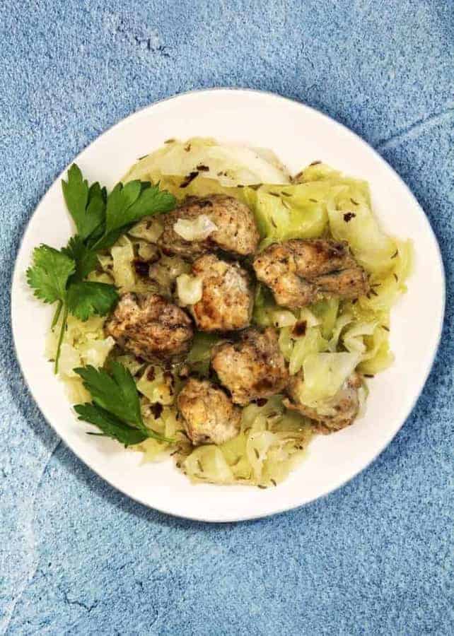 Homemade Instant Pot Low Carb Chicken Bratwurst and Cabbage dinner. This easy chicken sausage recipe makes meatballs that are very mildly spiced but flavorful, and sure to be very kid-friendly.