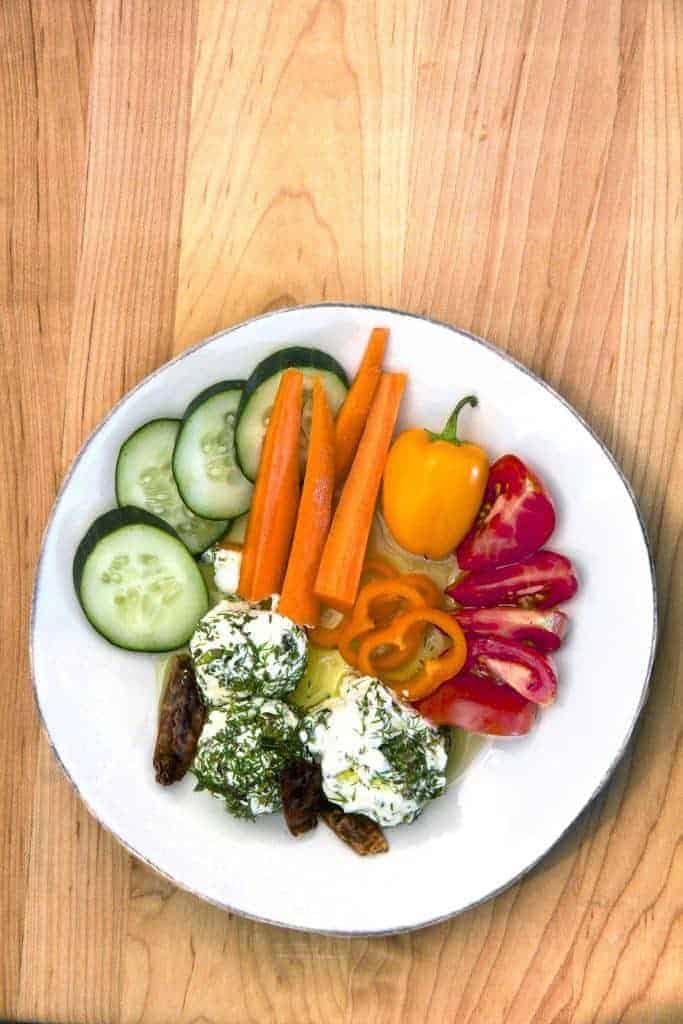 Labneh yogurt dill balls overhead with vegetables