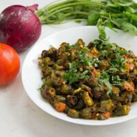 This recipe for Indian Bhindi Masala, or okra with onions and tomatoes, will be the easiest and most authentic recipe you will ever make. Make restaurant-style Bhindi Masala at home with very little effort. 