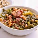 Dump and cook Southern style beans and greens cook up fast and creamy in your pressure cooker. Fast way to make dish that used to take all day on the stove. Omit ham hocks for vegan version.