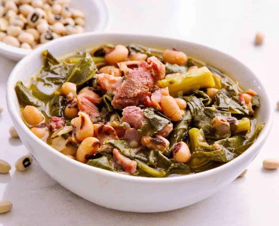 Dump and cook Southern style beans and greens cook up fast and creamy in your pressure cooker. Fast way to make dish that used to take all day on the stove.