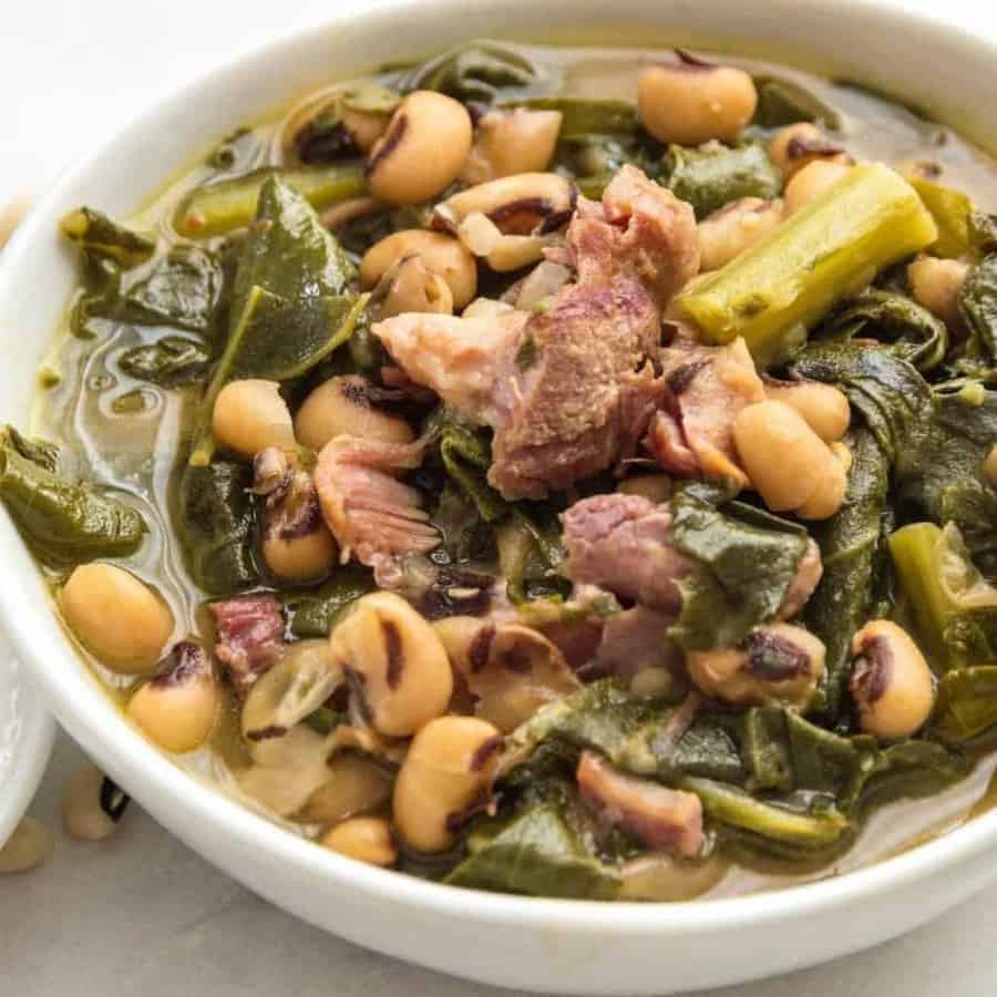 Dump and cook Southern style beans and greens cook up fast and creamy in your pressure cooker. Fast way to make dish that used to take all day on the stove. Omit ham hocks for vegan version.