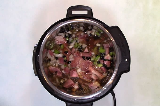 Overhead shot of keto ham and bean soup ingredients in the Instant Pot.