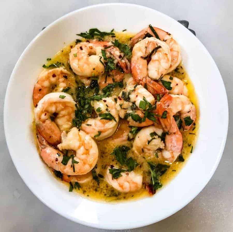Overhead shot of shrimp scamp. 8 minutes start to finish to make this air fryer keto low carb shrimp scampi. So simple to make, so delicious you won’t believe it.