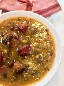 half bowl of low carb ham and bean soup overhead. No need to miss beans on a Keto Low carb diet! These use a secret, low carb bean that tastes fantastic! This low carb ham and bean soup tastes just like the real thing.