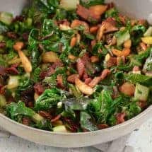 Make a quick Nutty Bacon Swiss Chard Sauté with garlic, pine nuts, and raisins for a low carb keto side dish that dresses up any meal in less than 20 minutes.