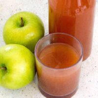 Glass of apple cider with two granny smith apples and a bottle of cider in the back. Here’s how you can start with fresh apples, and end up with some of the most flavorful Mulled Apple Cider you’ve had—in about 30 minutes. Choose the sweetener and spices of your choice to customize this Mulled Apple cider to your taste.