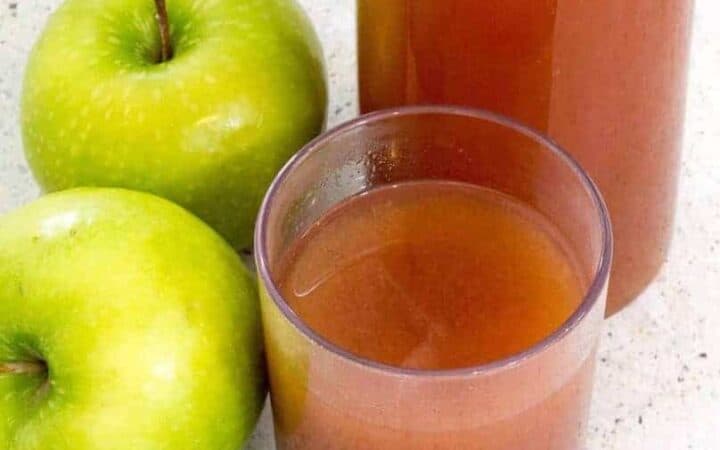 Glass of apple cider with two granny smith apples and a bottle of cider in the back. Here’s how you can start with fresh apples, and end up with some of the most flavorful Mulled Apple Cider you’ve had—in about 30 minutes. Choose the sweetener and spices of your choice to customize this Mulled Apple cider to your taste.