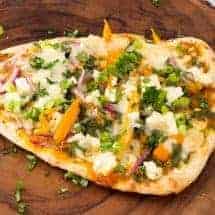 Cooked, finished butter chicken pizza
