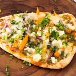 Cooked, finished butter chicken pizza