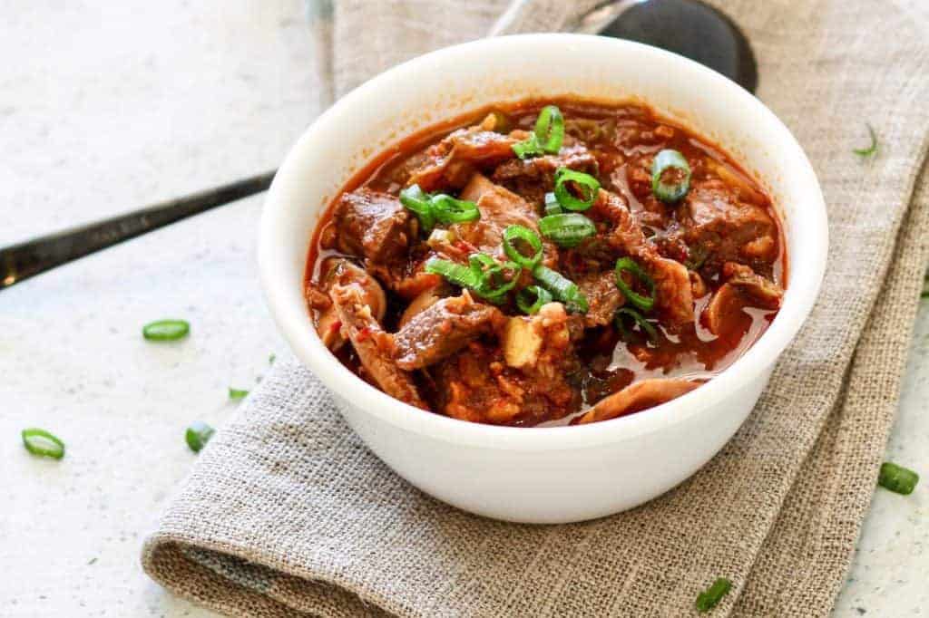 Instant Pot Pressure Cooker Low carb Kimchi Beef stew is an easy Korean-style dump and cook keto low carb recipe that's full of spicy, umami flavor. Guaranteed to perk up your taste buds, and taste like you slaved for hours to get this complex taste.