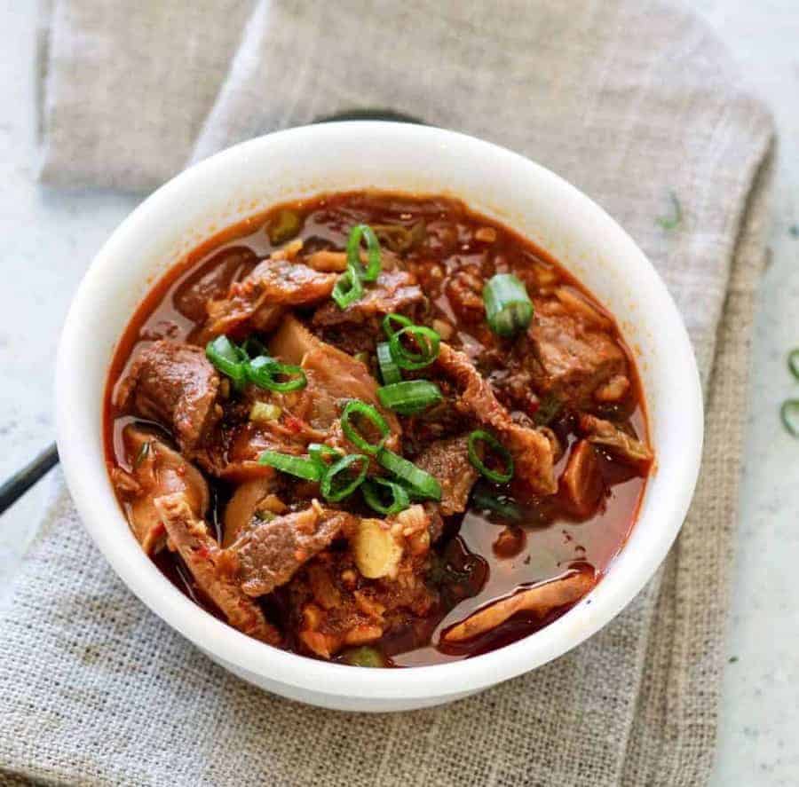 overhead kimchi beef stew. Instant Pot Pressure Cooker Low carb Kimchi Beef stew is an easy Korean-style dump and cook keto low carb recipe that's full of spicy, umami flavor. Guaranteed to perk up your taste buds, and taste like you slaved for hours to get this complex taste.