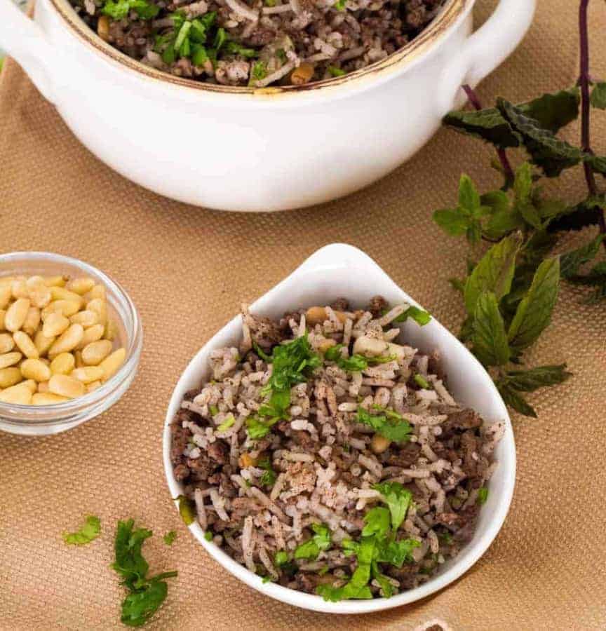 Lebanese hashweh combines ground meat and rice with pine nuts, allspice and other spices to make a wonderful side dish, or a flavorful stuffing for chicken or turkey. An easy one-step recipe can be made in a Pressure cooker, the Instant Pot Gem, or stovetop.