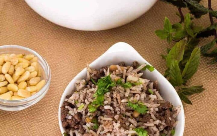 Lebanese hashweh combines ground meat and rice with pine nuts, allspice and other spices to make a wonderful side dish, or a flavorful stuffing for chicken or turkey. An easy one-step recipe can be made in a Pressure cooker, the Instant Pot Gem, or stovetop.