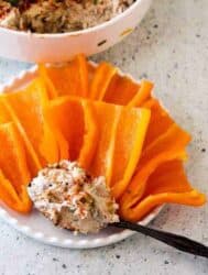Crazy Good Salmon Cream Cheese Dip Or how to spend $5 and have it taste like you spent about 4 times that much. Sophisticated, smoky, creamy, and absolutely yummy, this 5-ingredient salmon cream cheese dip is a crowd pleaser. 6 oz canned salmon, skinless, boneless 8 oz cream cheese 1 tablespoon Liquid smoke 1/4 cup chopped green onions 1/3 cup chopped pecans or walnuts 1 teaspoon Salt 1-2 teaspoons ground Pepper For Finishing 1 teaspoon Paprika for garnish Bring cream cheese to room temperature and mash with the back of a fork to soften. Gently mix in all the remaining ingredients. Allow dip to rest for 30 minutes at room temperature and mix once again. Garnish with paprika for a burst of color before serving.