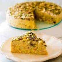 slice of crab quiche with rest of the keto crustless crab quiche in the back
