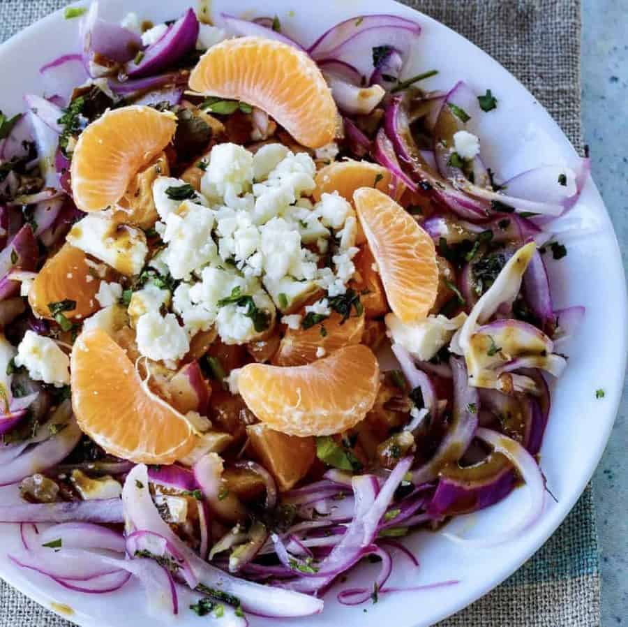 Pickled red onion orange salad with Feta cheese,  Mint, and cilantro. Date night food it is not. But let's be honest. We've all been on dates we would have gladly traded for a salad. This would be that salad.