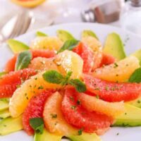 Grapefruit salad served on a white plate