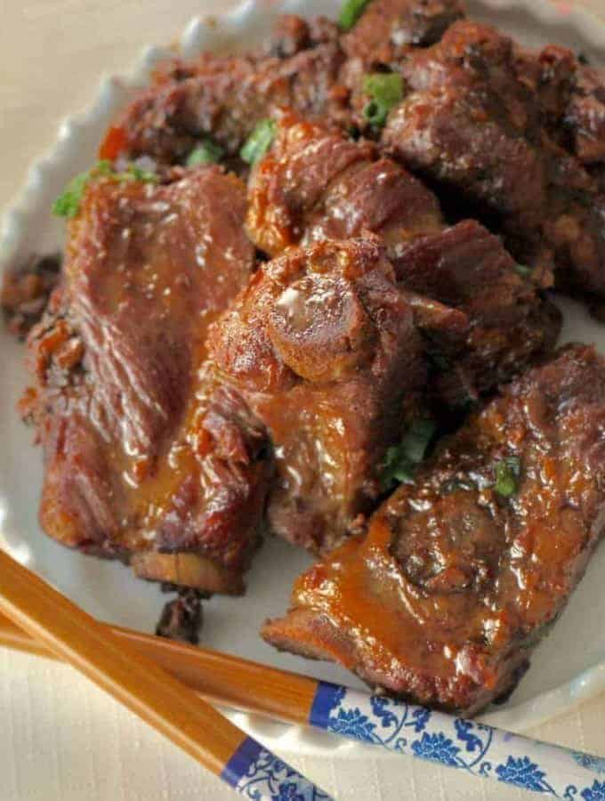 overhead view of braised spareribs with chopsticks