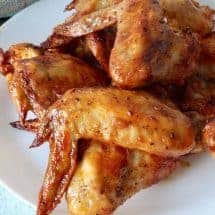 Tangy, sweet, spicy air fryer chicken wings with Gochujang make a delightful easy keto appetizer or meal. Make thee in your air fryer or oven and enjoy the finger-licking goodness.