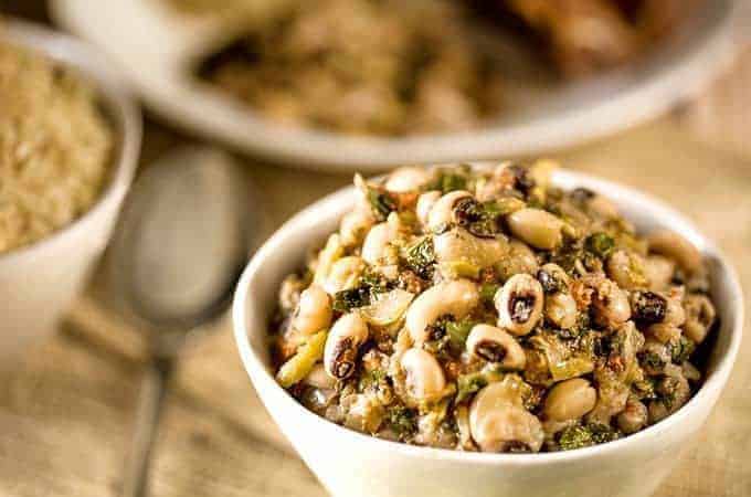 Instant Pot Kenyan Kunde is a nutritious recipe with black-eyed peas and peanuts in a white bowl sideways shot