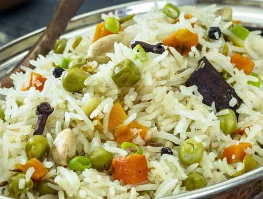 Close up image of Indian Pilau served in a metal bowl.