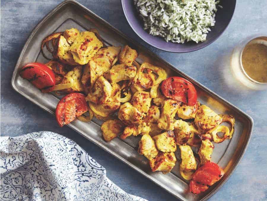 Joojeh Kabobs served on a metal platter with a side of rice