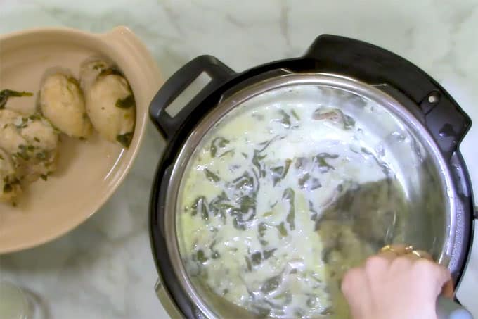Overhead shot of stirring the cream into the Chicken and Mushroom recipe.