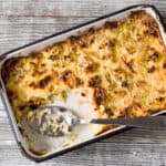 Keto Mac and Cheese in a casserole dish with a scoop taken out