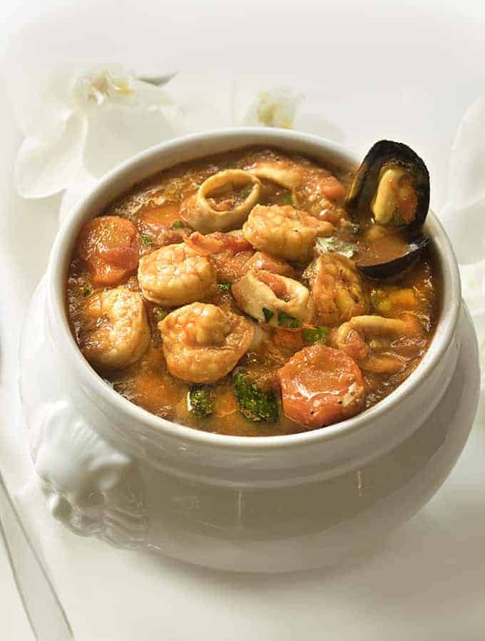 Cioppino Seafood Stew in a white bowl 