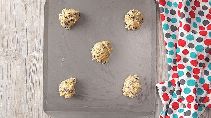 Overhead shot of spoonfuls of the batter laid out on a sheet pan.