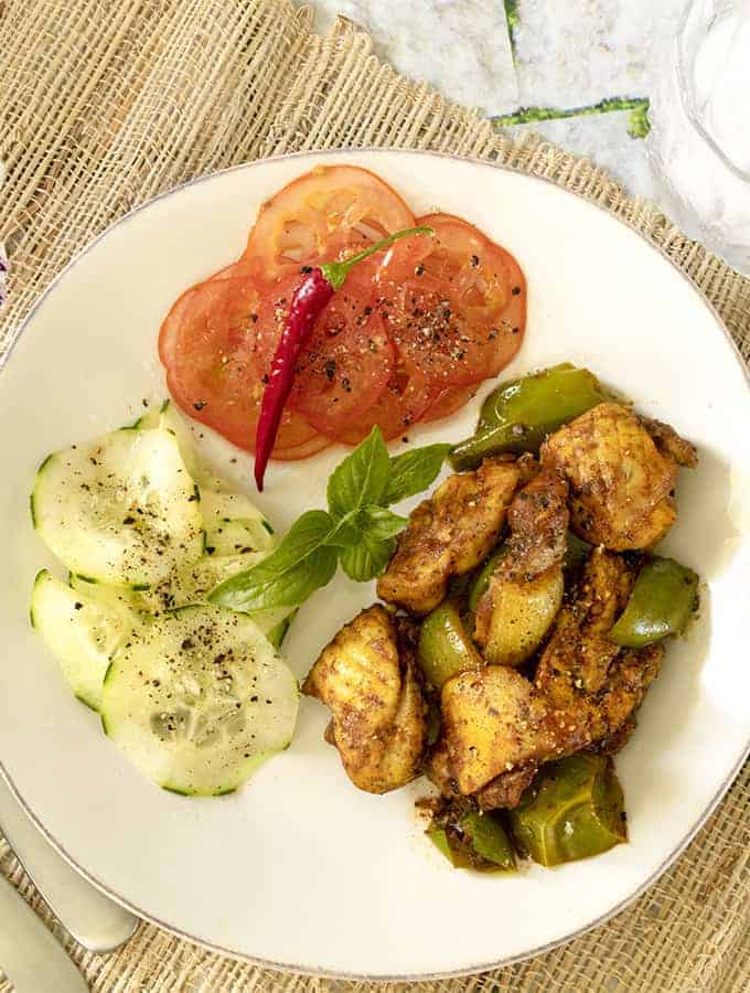 Chicken Jalfrezi overhead shot with cucumbers and tomato