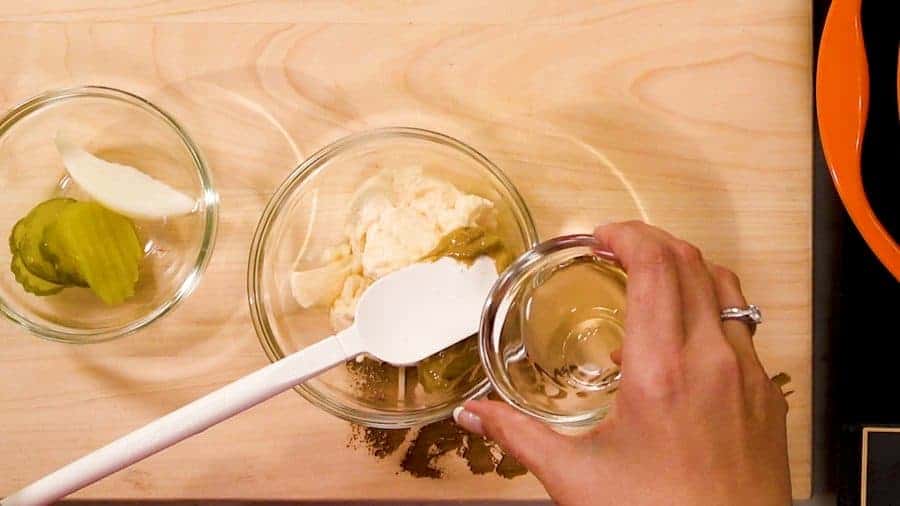 Overhead shot of mixing ingredients in a glass bowl