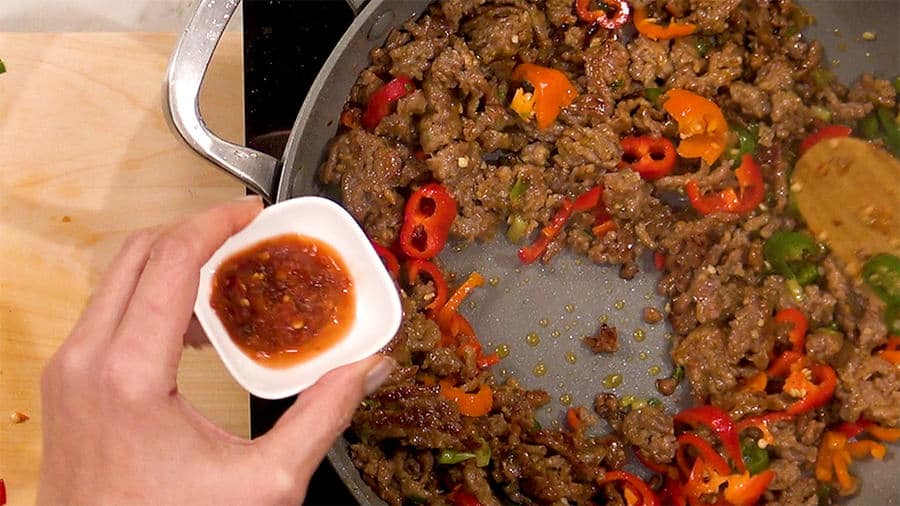 Add sambal olek, soy sauce, and sesame oil Add sambal olek, soy sauce, and sesame oil